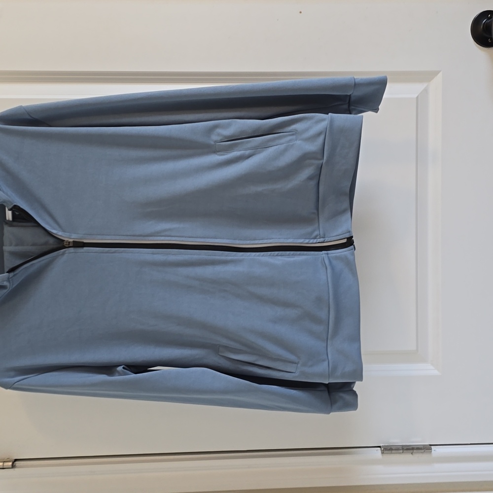 This is a blue gray jogging outfit the jacket and pants are a small extra large